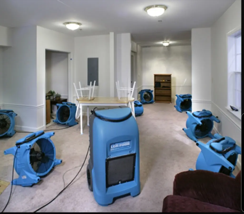 Air movers and dehumidifier setup for Water Damage Restoration in Box Elder